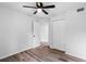 Spacious bedroom with wood-look floors and ceiling fan at 7874 Midway Drive Ter # V201, Ocala, FL 34472