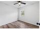 Simple bedroom with window and wood-look floors at 7874 Midway Drive Ter # V201, Ocala, FL 34472