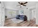 Living room with gray couch and wood-look floors at 7874 Midway Drive Ter # V201, Ocala, FL 34472