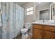 Bathroom with shower/tub combo and wood vanity at 8036 Sw 78Th Terrace Rd, Ocala, FL 34476