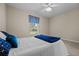 Bedroom with full bed, window, and ceiling fan at 8036 Sw 78Th Terrace Rd, Ocala, FL 34476