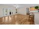 Hardwood floor living room with French doors and kitchen at 8036 Sw 78Th Terrace Rd, Ocala, FL 34476