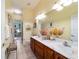 Bathroom boasts a double vanity with ample counter space and great lighting, perfect for your morning routine at 11031 Sw 69Th Cir, Ocala, FL 34476