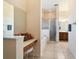 Bathroom with a vanity, soaking tub, and glass-enclosed shower at 11031 Sw 69Th Cir, Ocala, FL 34476
