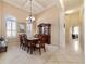 Bright dining room with ample natural light, a chandelier, and space for a large dining table at 11031 Sw 69Th Cir, Ocala, FL 34476