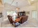 Bright and airy living area featuring tile flooring and a comfortable seating arrangement at 11031 Sw 69Th Cir, Ocala, FL 34476