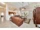 Open concept design connects the living room to the kitchen, featuring a sliding glass door to the outside at 11031 Sw 69Th Cir, Ocala, FL 34476