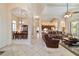 Open-concept living area with tile floors that flows seamlessly to the dining room at 11031 Sw 69Th Cir, Ocala, FL 34476