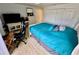 Spacious bedroom offers teal bedding, a home office setup, and large closet at 1326 Spring Lite Way, Orlando, FL 32825