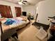 Main bedroom with a double bed and home gym at 1328 Spring Lite Way, Orlando, FL 32825