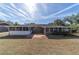 Brick home with screened porch and patio at 3261 Se 32Nd St, Ocala, FL 34471