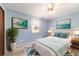 Second bedroom with light blue walls and a queen-size bed at 3261 Se 32Nd St, Ocala, FL 34471