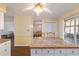 Kitchen with breakfast bar and view into dining area at 3261 Se 32Nd St, Ocala, FL 34471