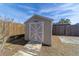 Tan storage shed with white doors and ramp at 3261 Se 32Nd St, Ocala, FL 34471