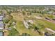 Aerial view of golf course and neighborhood homes at 407 Soft Shadow Ln, Debary, FL 32713