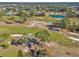 Aerial view of golf course and surrounding neighborhood at 407 Soft Shadow Ln, Debary, FL 32713