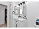 Modern bathroom with white vanity and black accents at 407 Soft Shadow Ln, Debary, FL 32713