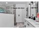 Bathroom boasts walk-in shower and vanity with a large mirror at 407 Soft Shadow Ln, Debary, FL 32713