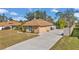 Brick home with attached garage and a long driveway at 407 Soft Shadow Ln, Debary, FL 32713