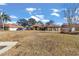 Front yard view of a house with a large lawn and driveway at 407 Soft Shadow Ln, Debary, FL 32713