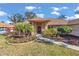 Brick house with landscaped yard and walkway at 407 Soft Shadow Ln, Debary, FL 32713