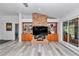 Brick fireplace as a focal point in the living room at 407 Soft Shadow Ln, Debary, FL 32713