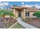 Inviting home entrance boasting a covered porch, decorative front door, and well-maintained garden beds at 407 Soft Shadow Ln, Debary, FL 32713