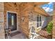 Inviting front entrance with a dark brown door and brick facade at 407 Soft Shadow Ln, Debary, FL 32713