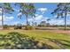 View of a lush green golf course with tall trees at 407 Soft Shadow Ln, Debary, FL 32713