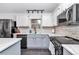 Contemporary kitchen featuring modern appliances, sleek countertops, and stylish backsplash at 407 Soft Shadow Ln, Debary, FL 32713