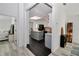 Bright kitchen with island, pendant lighting and black stainless steel appliances at 407 Soft Shadow Ln, Debary, FL 32713