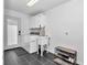 Clean laundry room featuring a sink, shelving, and exterior access at 407 Soft Shadow Ln, Debary, FL 32713