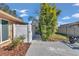 Side yard with a fence, walkway, and landscaping at 407 Soft Shadow Ln, Debary, FL 32713