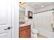 Small bathroom with single vanity, shower/tub combo, and decorative curtain at 9664 Sw 76Th Lane Rd, Ocala, FL 34481