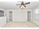 Spacious bedroom with carpet, ceiling fan, and access to hallway and other rooms at 9664 Sw 76Th Lane Rd, Ocala, FL 34481