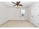 Bedroom with carpet flooring, ceiling fan, and window with sheer curtains at 9664 Sw 76Th Lane Rd, Ocala, FL 34481