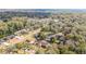 Residential neighborhood aerial view featuring homes surrounded by mature trees and landscaping at 2922 Se 38Th Pl, Ocala, FL 34480