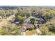 Aerial view of homes nestled among lush trees and landscaping in a quiet neighborhood at 2922 Se 38Th Pl, Ocala, FL 34480