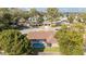 Aerial view of a home and large screened-in pool surrounded by mature trees at 2922 Se 38Th Pl, Ocala, FL 34480