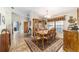 Formal dining room with wood table, chandelier and ornate furnishings at 2922 Se 38Th Pl, Ocala, FL 34480