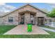 Exterior of brick home with a front entrance, brick paver patio, and well-manicured lawn at 2922 Se 38Th Pl, Ocala, FL 34480