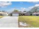 Inviting one-story brick home with a two-car garage and spacious front yard at 2922 Se 38Th Pl, Ocala, FL 34480