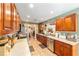 Well-lit kitchen with wood cabinets, stainless appliances, and tile flooring at 2922 Se 38Th Pl, Ocala, FL 34480