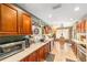 Functional kitchen design with plentiful cabinets, stainless steel appliances, and tile flooring at 2922 Se 38Th Pl, Ocala, FL 34480