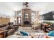 Relaxing living room with brick fireplace, two ceiling fans and lots of natural light at 2922 Se 38Th Pl, Ocala, FL 34480