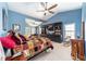 Beautiful main bedroom with vaulted ceilings, blue walls, and custom bookshelves at 2922 Se 38Th Pl, Ocala, FL 34480