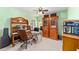 Office space with built-in shelving, desk, bright light, and a neutral color palette at 2922 Se 38Th Pl, Ocala, FL 34480