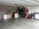 Garage with storage shelving and space for vehicles at 45 Orchid Ct, Kissimmee, FL 34759