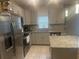 Modern kitchen with granite countertops and stainless steel appliances at 45 Orchid Ct, Kissimmee, FL 34759