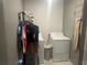 Laundry room with washer, dryer, and shelving at 45 Orchid Ct, Kissimmee, FL 34759